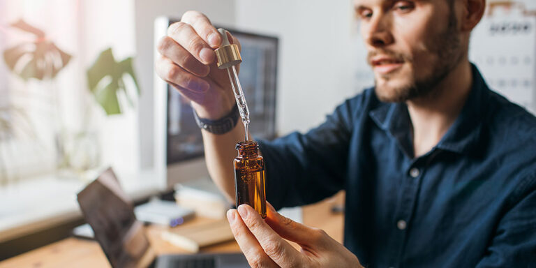 Close-up-man-uses-cbd-oil-medical-cannabis-healthy-lifestyle.jpg