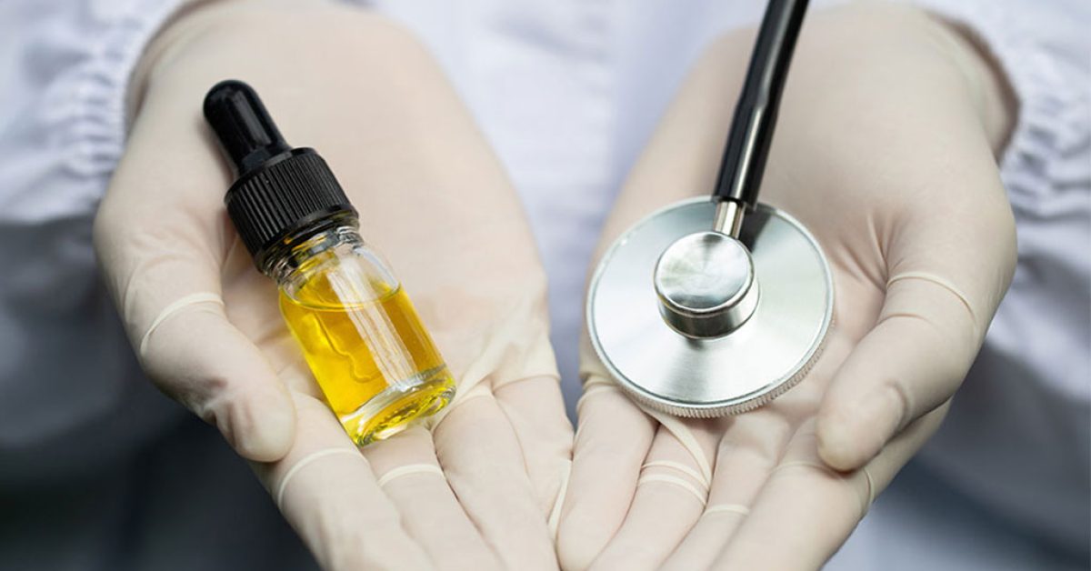Cbd-hemp-oil-bottles-and-medical-stethoscope-in-the-hands-img.jpg