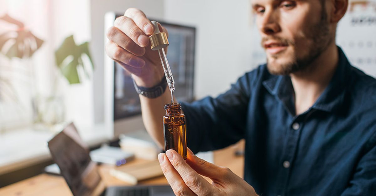 Close-up-man-uses-cbd-oil-medical-cannabis-healthy-lifestyle.jpg